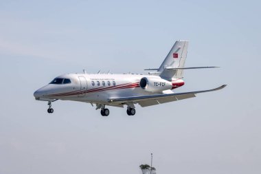 Luqa, Malta - February 17, 2025: Turkey State Airports Authority Cessna 680A Citation Latitude (REG: TC-FCF) coming in low for landing runway 31. clipart