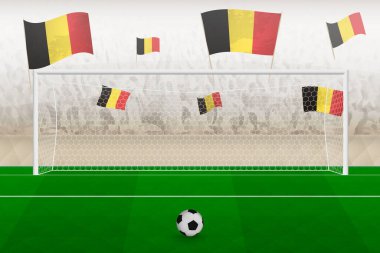 Belçika futbol takımının taraftarları stadyumda bayrak sallıyor, futbol maçında penaltı vuruşu kavramı.
