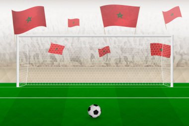 Fas futbol takımının taraftarları Fas bayraklarıyla stadyumda tezahürat yapıyor. Futbol maçında penaltı konsepti..