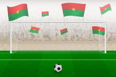Burkina Faso futbol takımının taraftarları, Burkina Faso bayraklarıyla stadyumda tezahürat yapıyor, futbol maçında penaltı konsepti..