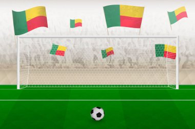 Benin futbol takımının taraftarları stadyumda Benin bayrakları ile tezahürat yapıyor, futbol maçında penaltı konsepti.