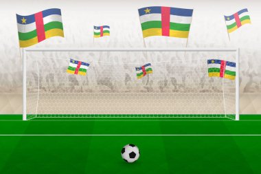 Orta Afrika Cumhuriyeti futbol takımı taraftarları Orta Afrika Cumhuriyeti bayraklarıyla stadyumda tezahürat yapıyor, futbol maçında penaltı vuruşu kavramı.