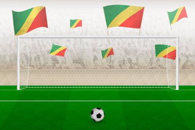 Kongo futbol takımının taraftarları stadyumda bayrak sallıyor, futbol maçında penaltı vuruşu kavramı.