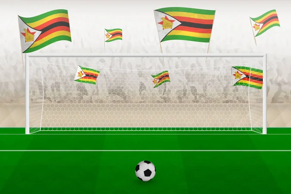 Zimbabwe futbol takımı taraftarları stadyumda bayrak sallıyor, futbol maçında penaltı vuruşu konsepti..