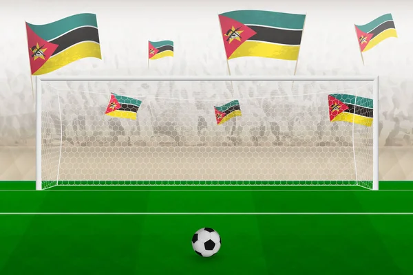 Mozambik futbol takımının taraftarları Mozambik bayrakları ile stadyumda tezahürat yapıyor, futbol maçında penaltı vuruşu kavramı.