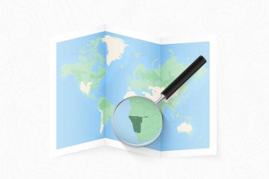 Enlarge Namibia with a magnifying glass on a folded map of the world.
