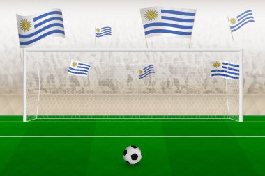 Uruguay futbol takımının taraftarları stadyumda bayrak sallıyor, futbol maçında penaltı vuruşu konsepti.