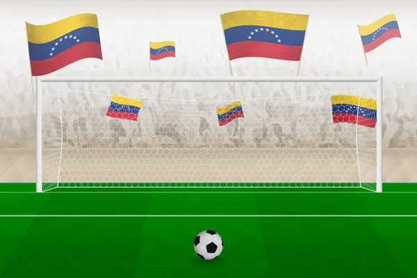 Venezuela futbol takımının taraftarları stadyumda bayrak sallıyor, futbol maçında penaltı vuruşu konsepti.