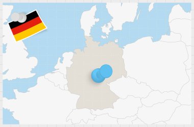 Map of Germany with a pinned blue pin. Pinned flag of Germany.