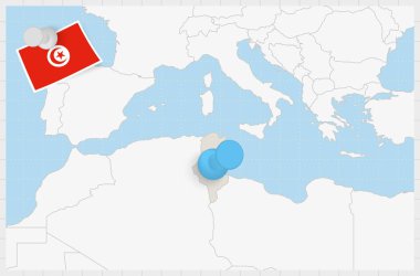 Map of Tunisia with a pinned blue pin. Pinned flag of Tunisia.