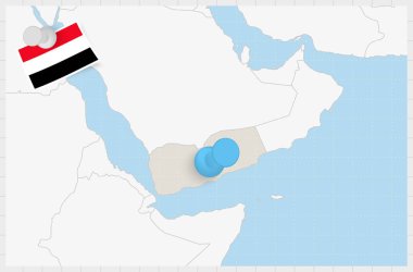 Map of Yemen with a pinned blue pin. Pinned flag of Yemen.