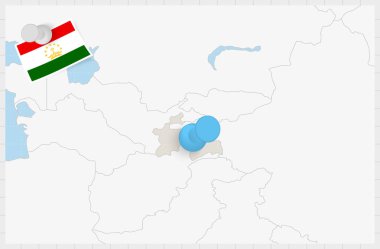Map of Tajikistan with a pinned blue pin. Pinned flag of Tajikistan.