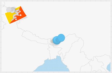 Map of Bhutan with a pinned blue pin. Pinned flag of Bhutan.
