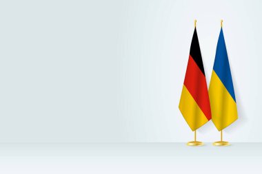 Flags of Germany and Ukraine on flag stand, meeting between two countries. 