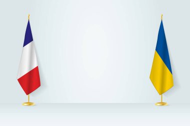 France and Ukraine flag on indoor flagpole, meeting concept between Ukraine and France.