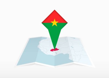 Burkina Faso katlanmış bir kağıt haritada resmedilmiş ve Burkina Faso bayrağıyla işaretlenmiş..