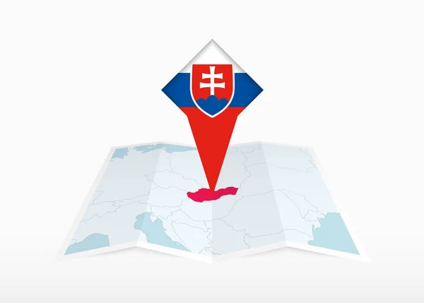 スロバキアは折り畳まれた紙の地図上に描かれ スロバキアの旗と固定位置マーカー — ストックベクタ