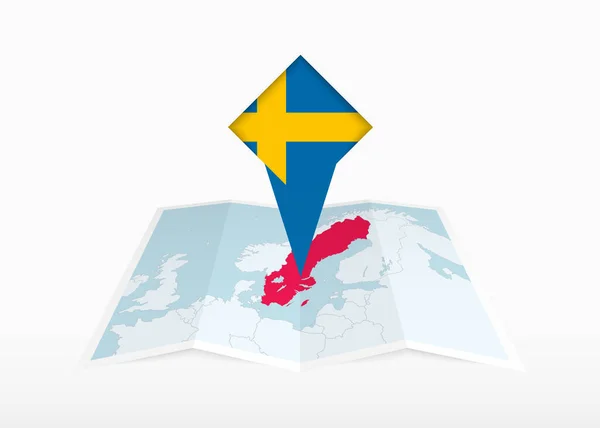Svédország Ábrázolja Egy Hajtogatott Papír Térkép Tűzött Helyzetjelző Zászlóval Svédország — Stock Vector