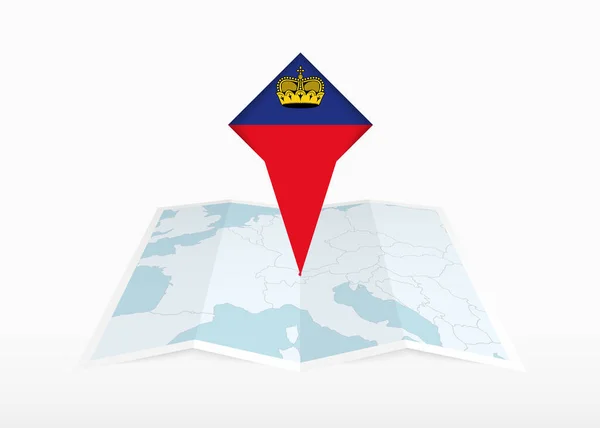 列支敦士登被描绘在一张折叠的纸质地图上 并被钉上印有列支敦士登国旗的位置标识 — 图库矢量图片