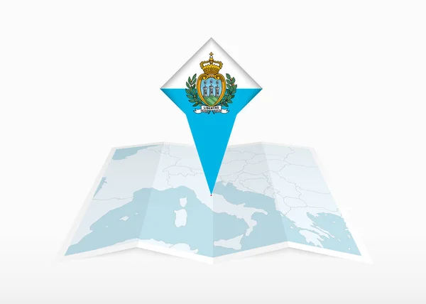 圣马力诺被描绘在一张折叠的纸质地图和印有圣马力诺国旗的别针定位标识上 — 图库矢量图片