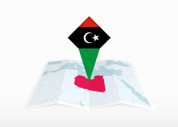 Libya Kuvattu Taitetulla Paperikartalla Kiinnitetyllä Paikannusmerkillä Jossa Libyan Lippu — vektorikuva