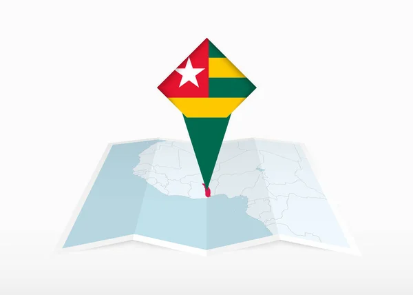 Togo Jest Przedstawiony Składanej Papierowej Mapie Przypięty Znacznik Lokalizacji Flagą — Wektor stockowy