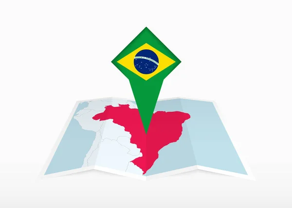 Brazílie Vyobrazena Skládané Papírové Mapě Připíchnuté Značce Lokality Vlajkou Brazílie — Stockový vektor