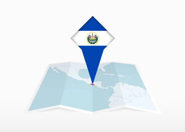 エルサルバドルは折り畳まれた紙の地図上に描かれ エルサルバドルの旗で固定された位置マーカー — ストックベクタ