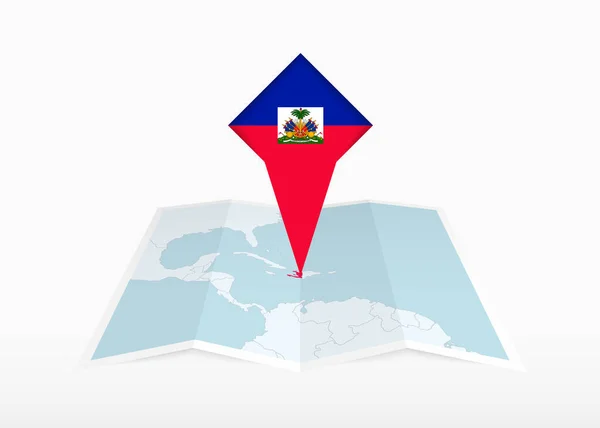ハイチは折り畳まれた紙の地図上に描かれ ハイチの旗で固定された場所のマーカー — ストックベクタ
