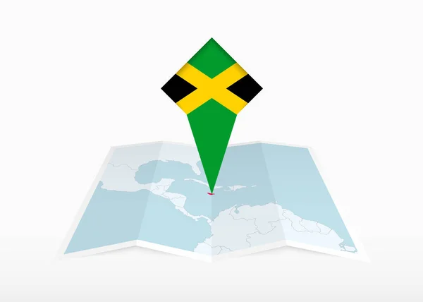 Jamajka Vyobrazena Skládané Papírové Mapě Připíchnuté Značce Lokality Vlajkou Jamajky — Stockový vektor
