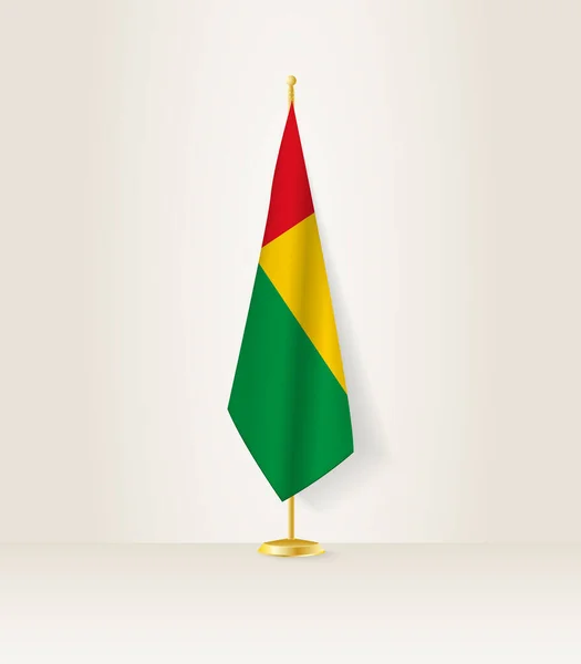 stock vector Guinea-Bissau flag on a flag stand.