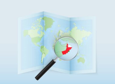 Büyüteçle Umman 'ı gösteren katlanmış bir dünya haritası. İtalya haritası ve bayrağı.