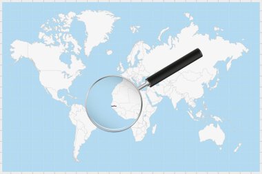 Bir dünya haritasında Gambiya haritasını gösteren büyüteç.