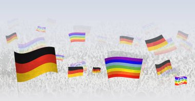 İnsanlar Almanya 'nın bayraklarını ve bayraklarını sallıyor. Kalabalığın Almanya bayrağı ve barış bayrağıyla kutlama ya da protesto gösterileri. 