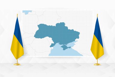Ukrayna haritası ve bayrak standında Ukrayna bayrakları.