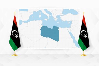 Libya haritası ve bayrak standında Libya bayrakları.