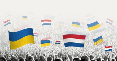 Hollanda ve Ukrayna 'nın bayrağını sallayan insanlar, Hollanda' nın Ukrayna için dayanışmasını sembolize ediyor.