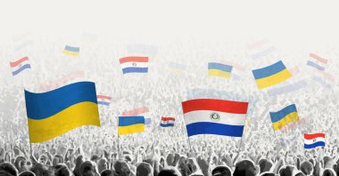 Paraguay ve Ukrayna 'nın bayrağını sallayan insanlar, Paraguay' ın Ukrayna için dayanışmasını simgeliyor..