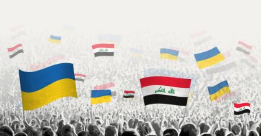 Irak ve Ukrayna 'nın bayrağını sallayan insanlar, Ukrayna' nın Irak dayanışmasını sembolize ediyor..