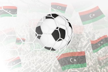 Libya Millî Futbol Takımı gol attı. Futbol taraftarları arka planda Libya bayrağını sallarken, top kale ağında..