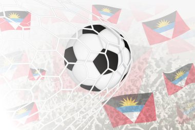 Antigua ve Barbuda Millî Futbol Takımı gol attı. Futbol taraftarları arka planda Antigua ve Barbuda bayrağını sallarken, top kale ağında..