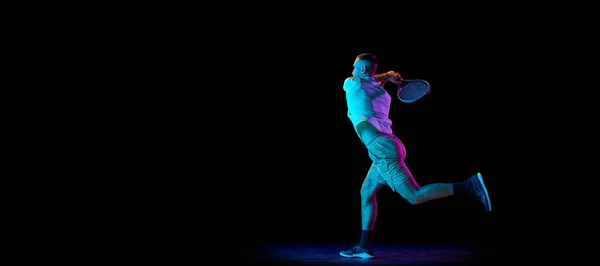 Young Sportive Man Professional Tennis Player Motion Action Isolated Dark — Stock Photo, Image