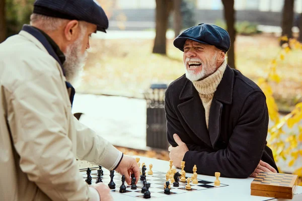 Portrait Two Senior Men Playing Chess Park Daytime Fall Happy — Stock Photo, Image