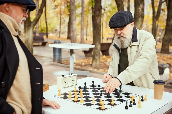 Portrait Two Senior Men Playing Chess Park Daytime Fall Buddies — Stock Photo, Image