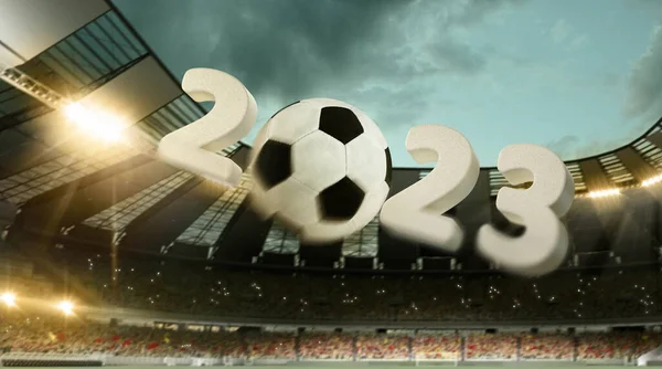 Flight of soccer football ball through crowded stadium with spotlights in evening time. Concept of sport, art, energy, power. Poster for ad, design. Creative collage. Unfocus effect. 2023 New year