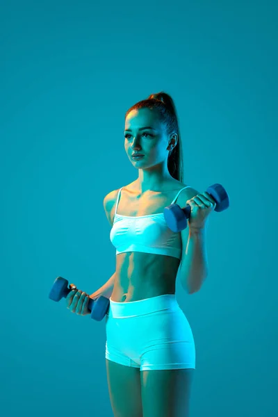 Young Sportive Girl White Sportswear Training Dumbbells Isolated Blue Studio — Stock Photo, Image
