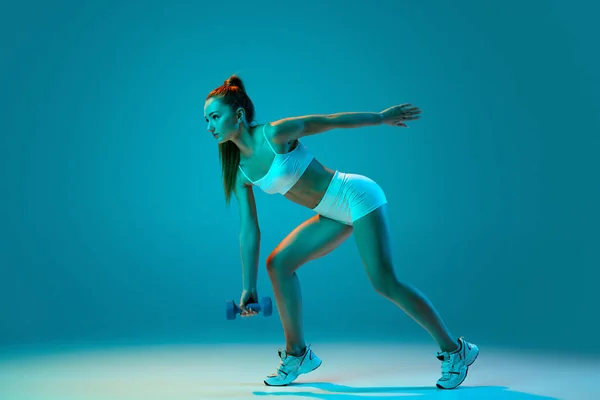 Young Sportive Girl White Sportswear Training Dumbbells Isolated Blue Background — Stock Photo, Image