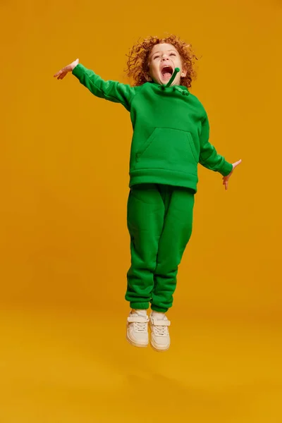 Portrait Cute Little Girl Child Curly Red Hair Cheerfully Jumping — Stock Photo, Image