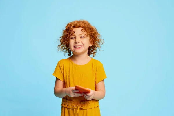 Portrait Cute Little Girl Child Curly Red Hair Playing Phone — Stock Photo, Image