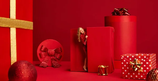 Cstylish Beautiful Woman Sparkling Dress Appearing Present Box Red Background — Stock Photo, Image